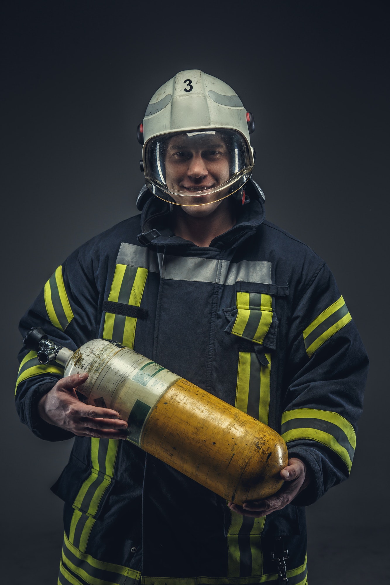 firefighter-rescue-holds-yellow-oxygen-tank-.jpg firefighter-rescue-holds-yellow-oxygen-tank-.jpg